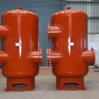 Air separator with strainer